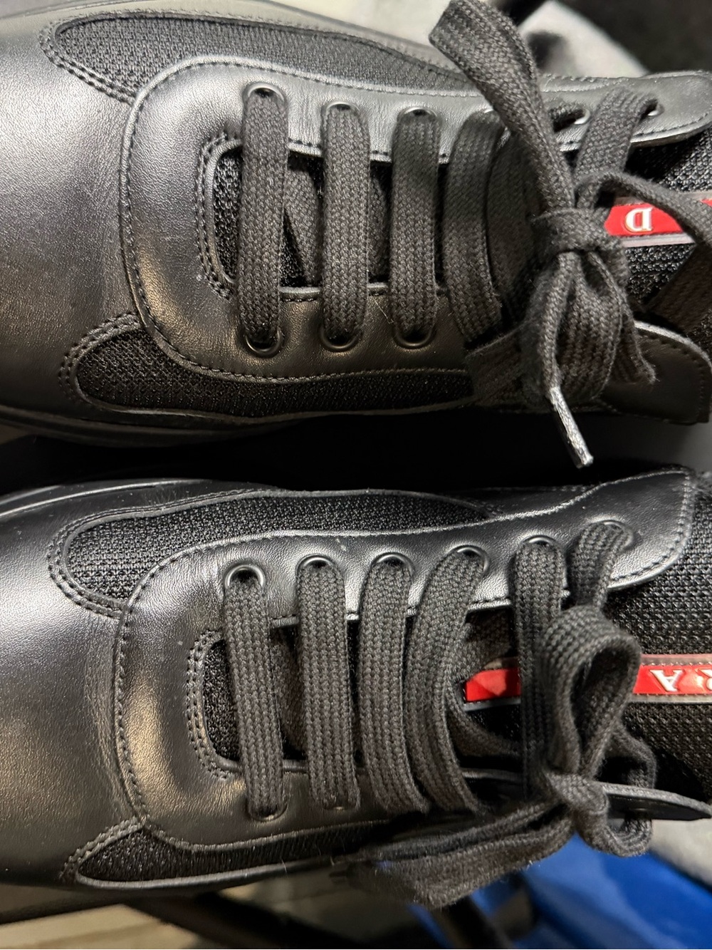 Prada Men's Black Leather & Mesh Lace-Up Sneakers with Red Logo Tab